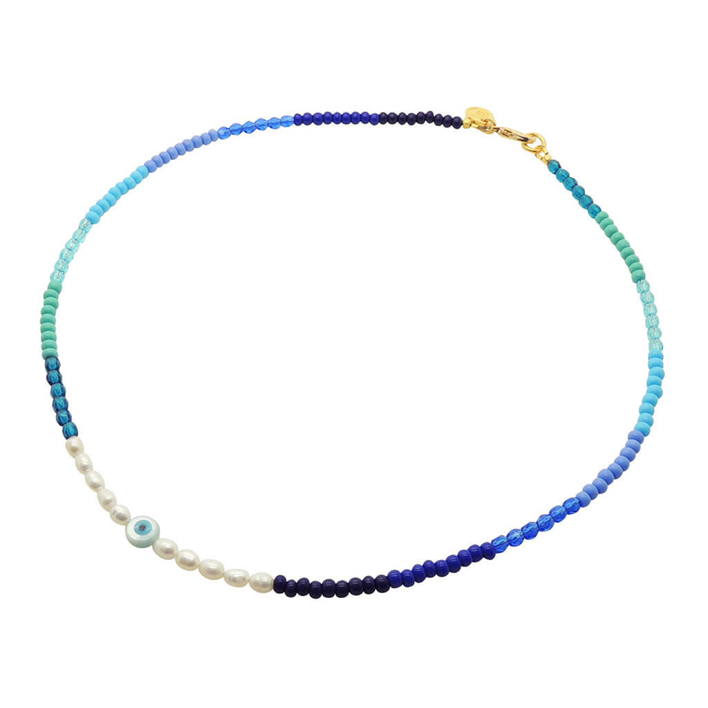 Dana Levy Ocean Pearl Amulet Bead Necklace with a mother of pearl round tablet charm with evil eye.