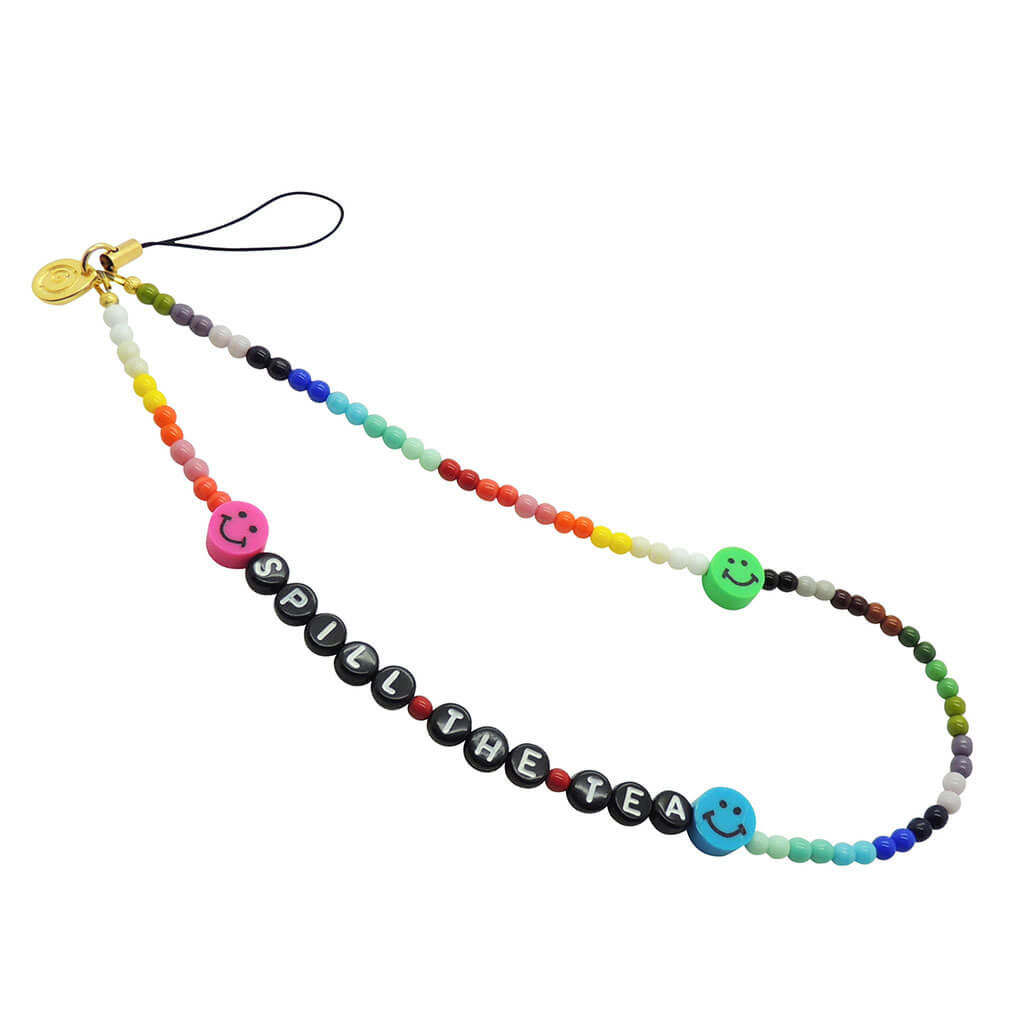 Dana Levy Personalised Name Rainbow Glass Bead Phone Wristlet Strap that reads Spill the Tea with Multicolour Smiley Charms.