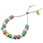 Dana Levy Personalised Initial Alphabet Cube Charm Candy Bead Satin Cord Bracelet with a Heart Charm and Pastel Bead Mix on Lilac Cord.