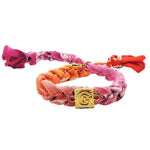 Dana Levy Alphabet Charm Bandana Braid Bracelet with the letter G on a Fuchsia pink orange ombre tie dye bandana braid bracelet.