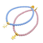 Dana Levy Little Icons Glass Bead Bracelet s duo - Gold plated boy icon with cornflower blue glass beads, and girl icon with light pink glass beads. 