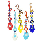Dana Levy Hamsa Hand Talisman Wall Hangings in a variety of colours: Red, White, Yellow, Turquoise and Royal Blue. 