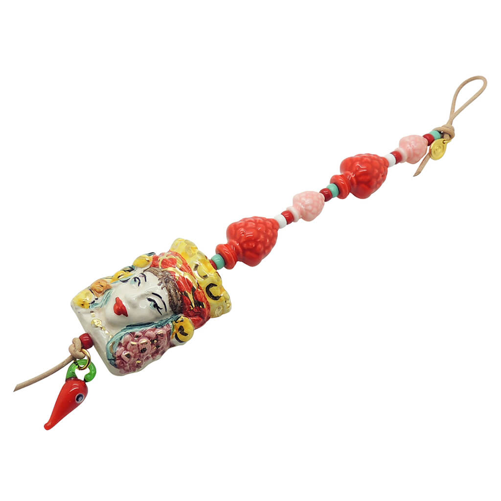 Dana Levy Sicilian Testa di Moro Charm Wall Hanging - Female Head with red and pink pines cones and a red evil eye chilli. 