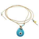 Dana Levy Glass Evil Eye Amulet Leather Lariat Cord Necklace with an opaque turquoise evil eye amulet on natural leather cord.