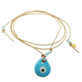 Dana Levy Glass Evil Eye Amulet Leather Lariat Cord Necklace with an opaque turquoise evil eye amulet on natural leather cord.