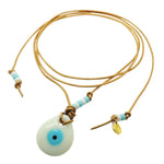 Dana Levy Glass Evil Eye Amulet Leather Lariat Cord Necklace with an opaque white evil eye amulet on bronze leather cord. 
