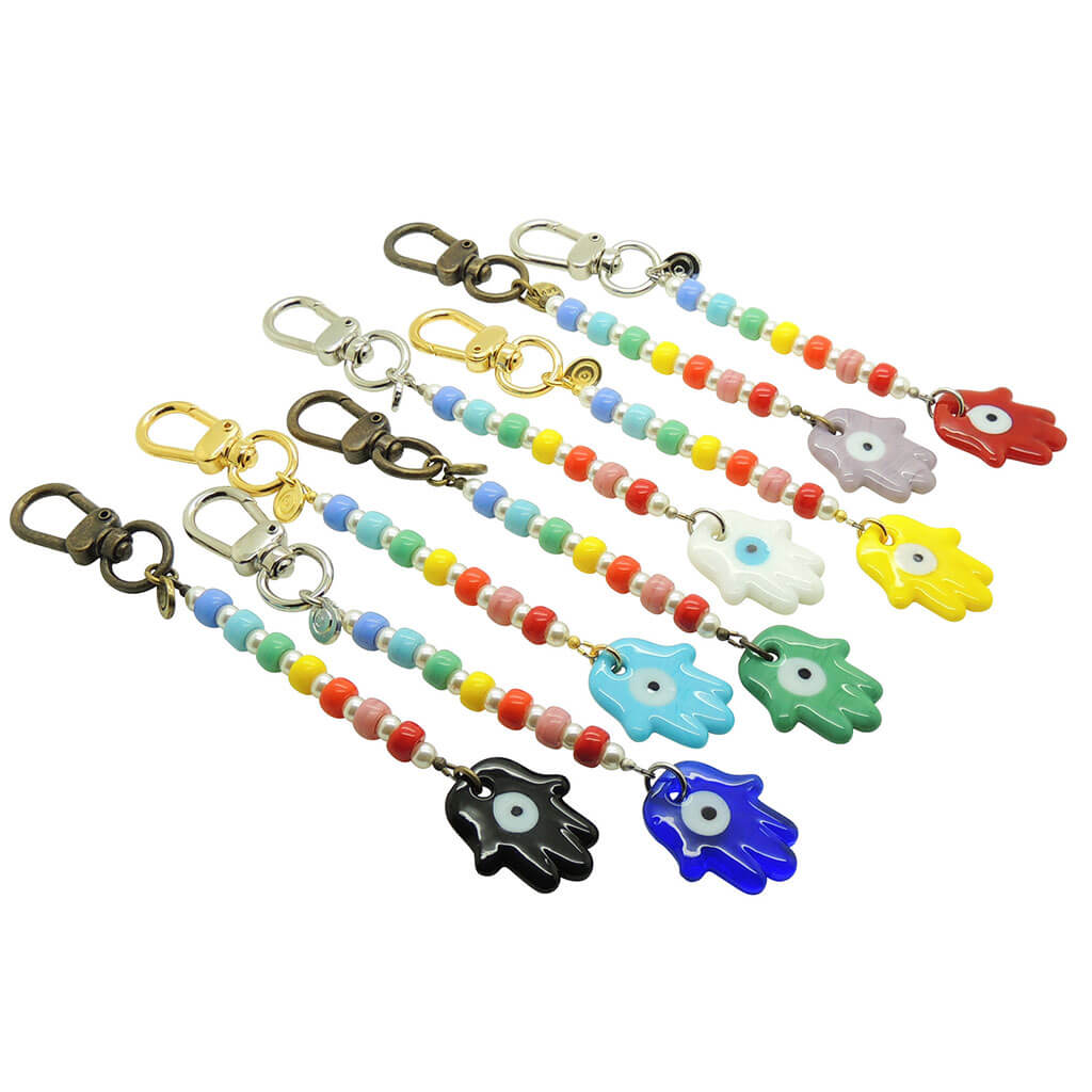 Dana Levy Glass Hamsa Hand Amulet Rainbow Pearl Bag Charm - A Group of Bag Charms in a Rainbow Spectrum of Colours