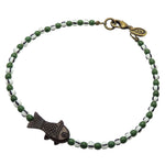 Dana Levy dark brown bone fish charm striped glass bead mix anklet with forest green glass beads and white/black striped glass beads and an antique gold plated clasp on a white background. 