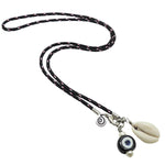 Dana Levy black nautical cord necklace with a black glass evil eye and a cowrie shell charm on a white background.