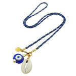 Dana Levy navy blue nautical cord necklace with royal blue evil eye and cowrie shell charm on a white background.