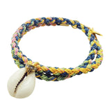 Dana Levy diamante cowrie shell charm braid cord bracelet in yellow pink blue green colours on a white background. 