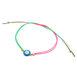 Dana Levy teal enamel evil eye amulet neon rainbow cord bracelet on a white background.