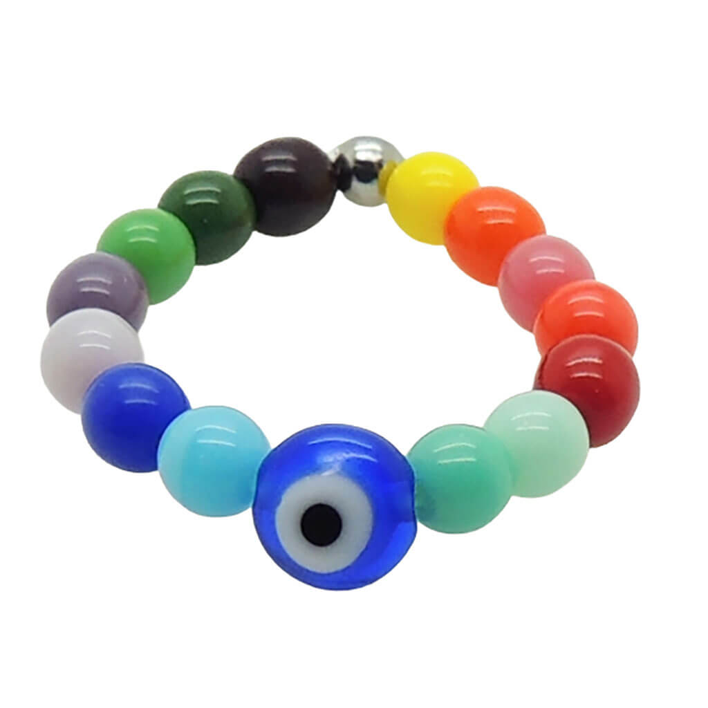 Dana Levy evil eye charm rainbow glass bead pinkie ring with a royal blue evil eye on a white background.  