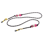 Dana Levy black glasses cord with colourful charms and silicone clasps on a white background