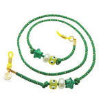 Dana Levy green sunglasses cord with colourful lucky charms and yellow toggles on a white background