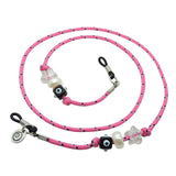 Dana Levy pink cord eyeglass holder with decorative lucky charm beads on a white background