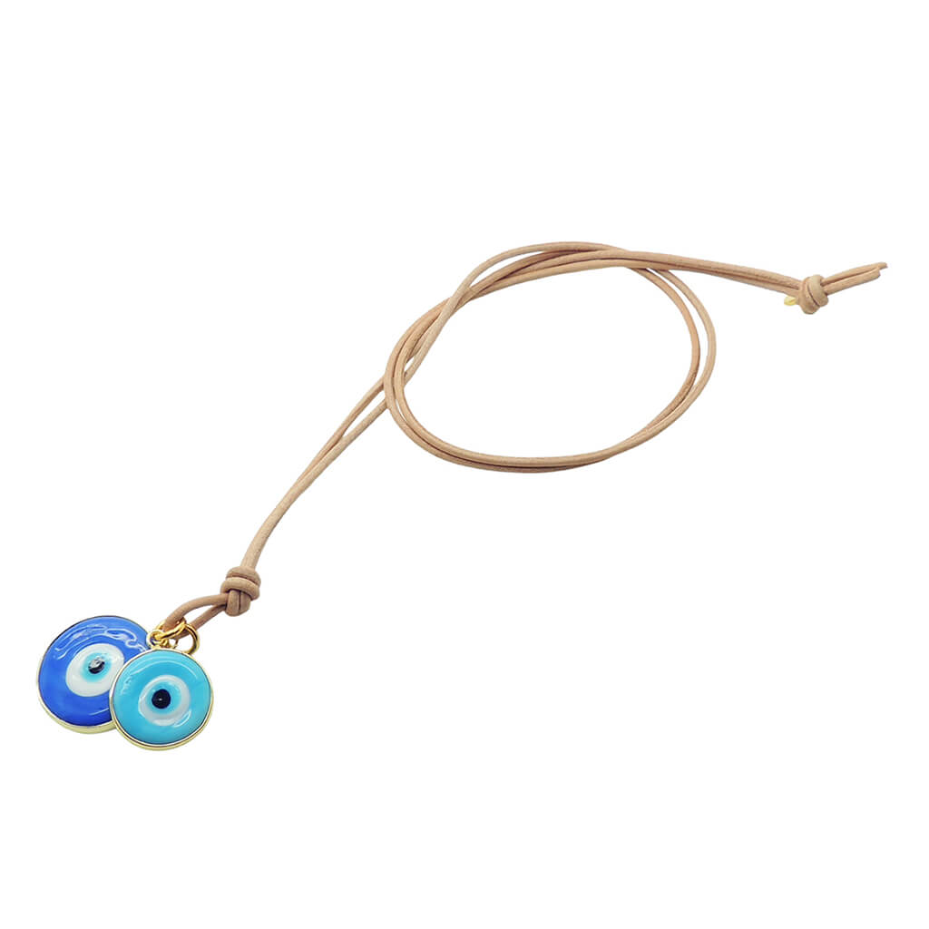 Dana Levy evil eye disc duo leather cord necklace with large blue and small turquoise evil eyes on natural leather cord on a white background. 