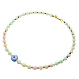 Dana Levy cornflower blue evil eye amulet necklace with multicoloured rainbow and mother of pearl gemstone beads on a white background.