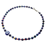 Dana Levy evil eye amulet necklace with multicoloured rainbow and sodalite gemstone beads on a white background.