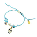 Dana Levy light blue nautical cord bracelet with decorative lucky charms on a white background.