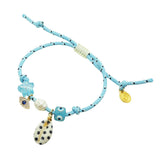 Dana Levy light blue nautical cord bracelet with decorative lucky charms on a white background.