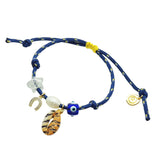 Dana Levy navy blue nautical cord bracelet with various lucky charms on a white background.