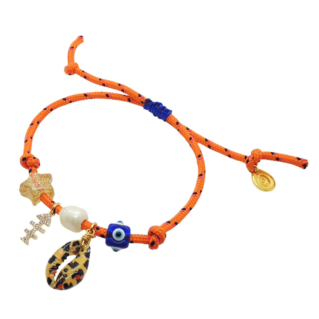 Dana Levy orange nautical cord bracelet with various lucky charms on a white background.