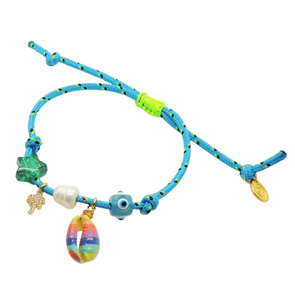 Dana Levy turquoise nautical cord bracelet with various charms on a white background.