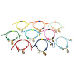 Dana Levy set of nine colourful cord bracelets with various lucky charms on a white background.