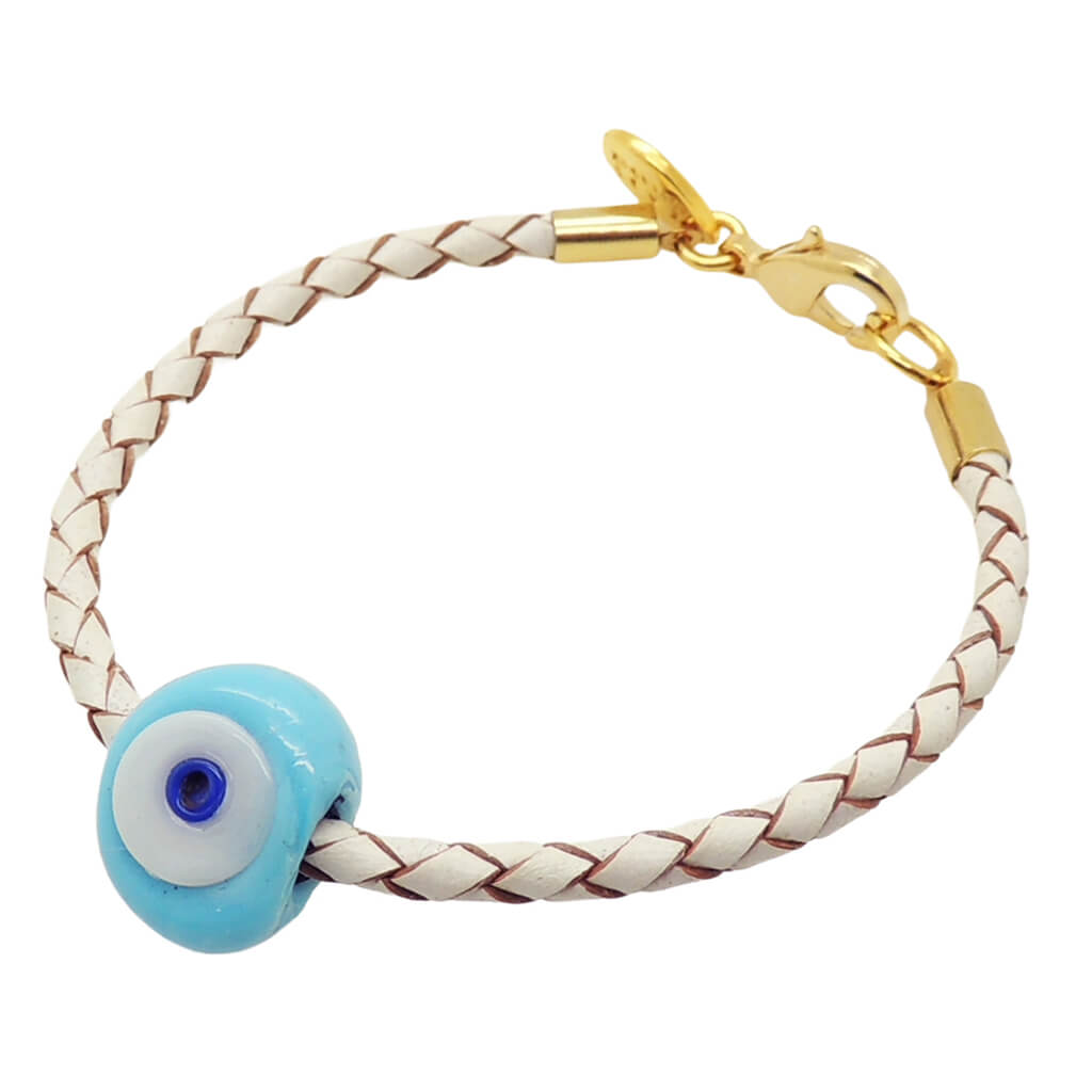 Dana Levy  white braided leather bracelet with a gold plated clasp and an opaque turquoise blue glass evil eye charm, on a plain white background.