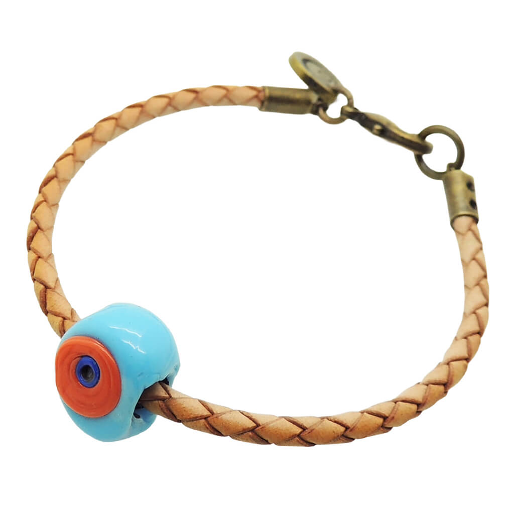 Dana Levy natural tan leather braid bracelet with an opaque turquoise and orange glass evil eye amulet, shown on a plain white background.