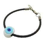 Dana Levy black braided leather bracelet with a silver plated lobster clasp and a white chunky glass evil eye charm featuring light blue and dark blue details, shown on a plain white background.
