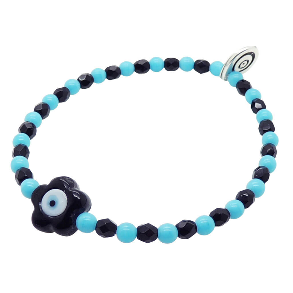 Dana Levy Black glass evil eye flower charm glass bead mix bracelet with  opaque turquoise beads and jet black faceted glass beads on white background. 