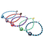 Dana Levy glass evil eye flower charm glass bead mix bracelets in a variety of colour mixes on a white background. 