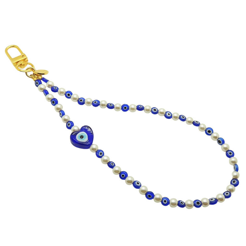 Dana Levy Glass Evil Eye Heart Faux Pearl Beaded Phone Wristlet Strap with a Royal Blue Evil Eye Heart Charm and Evil Eye Beads on a White Background.