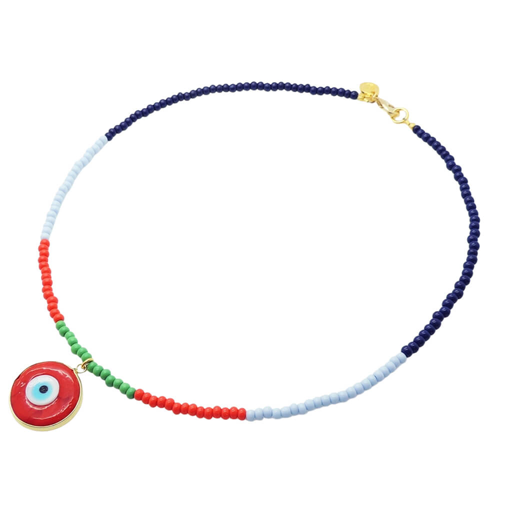 A Dana Levy beaded necklace featuring segments of navy blue, light blue, red, and green glass beads, with a red evil eye disc pendant charm and a gold clasp, shown on a plain white background.