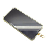 Dana Levy clear iphone case with metal phone charm strap card on a white background.