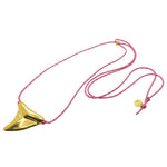 Dana Levy gold plated large shark tooth amulet on a thin pink nautical cord necklace, on a white background. 