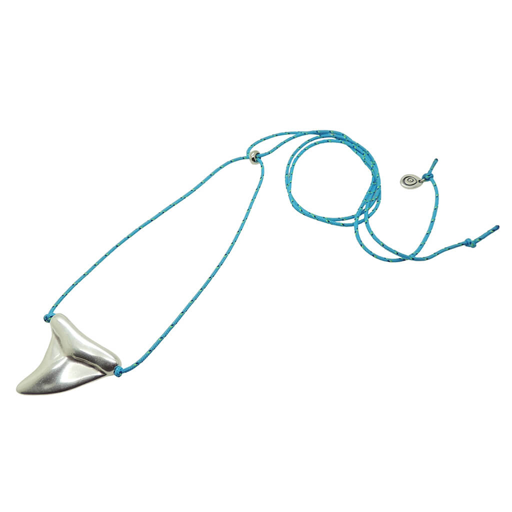 Dana Levy silver plated oversized shark tooth amulet on a turquoise nautical cord necklace, on a white background. 