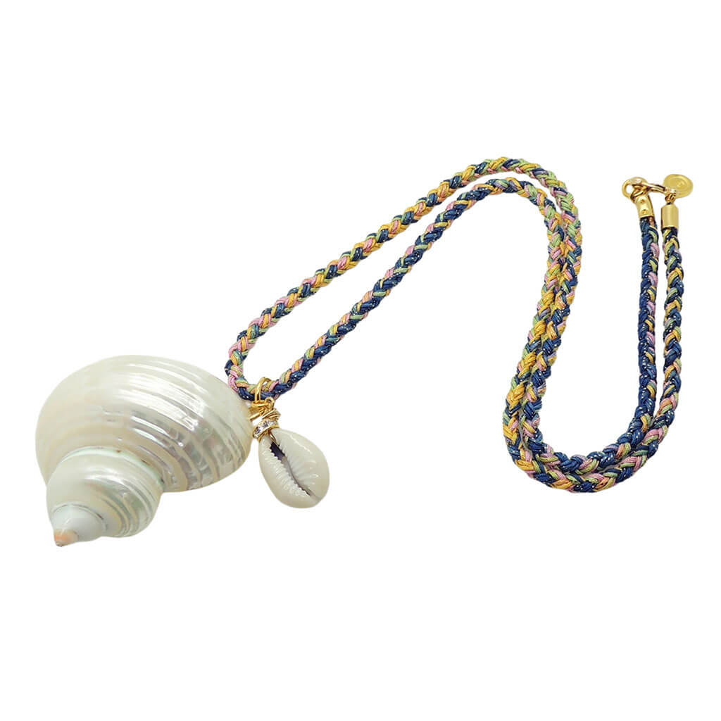 Dana Levy large spiral seashell charm with a small cowrie shell charm on a pink yellow and blue braid cord necklace on a white background. 