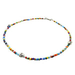 A silver plated brass skull charm trio beaded necklace with multicolour glass beads, by Dana Levy.