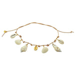 Dana Levy leather cord necklace with gold plated and shell pendants on a white background.
