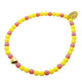 Dana Levy mini bubble heart charm yellow and pink glass bead bracelet on white background. 