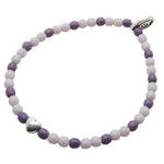 Dana Levy bracelet with purple and lilac glass beads and a silver heart charm on a white background.