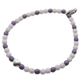 Dana Levy bracelet with purple and lilac glass beads and a silver heart charm on a white background.