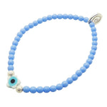 Dana Levy cornflower blue glass bead bracelet with a white evil eye star charm and shiny silver stardust beads. 