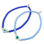 Dana Levy pair of glass bead bracelets in royal blue and cornflower blue coloured glass beads with a turquoise and white evil eye star charms and silver stardust beads. 