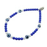 Dana Levy bracelet with blue and white evil eye and glass beads on a white background