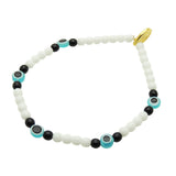 Dana Levy white and black glass bead bracelet with turquoise evil eye beads on a white background 