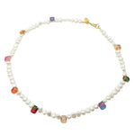 A Dana Levy freshwater pearl necklace with multicolour Ombre Rhinestone Crystals spaced along necklace, with a gold plated necklace, on a white background.